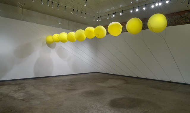 "Slow Release"; 2014; balloons, parachute cord, hardware; dimensions variable