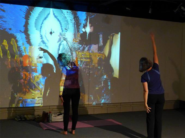 “Mirror Minus” (Yoga in the Gallery, 5/2/14, Rosewood Art Gallery, Kettering, OH), Interactive installation (video projection and camera), 9’x12’ projection, 2014