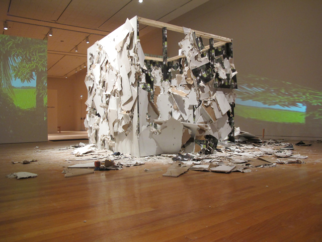 PriBlan,Multimediatemporalinstallationanddurational performance (performance in collaboration with Fabiola Menchelli) including: Drywall, wallpaper, screws, paint, sledge hammers, drill, wood, double .jpg projection on 1 min. loop, 300 sq. ft, 2011