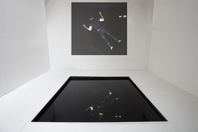 "Repeating Histories" Multimedia installation consisting of black reflecting pool, performance for the camera, and video projection. 2013 