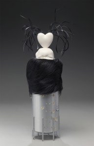 "Love Nest," Porcelain, fur muff, swan feathers and plastic, 26” h x 10” w x 7” d, 2009.