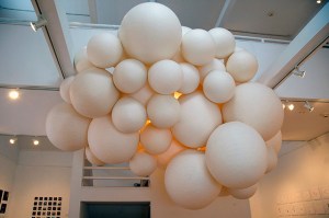 Orbs. Architectural Tracing vellum, water, Elmer’s glue. 24” – 52” diameter (50 orbs pictured). 2014. Installation view at the University of Maine at Farmington Art Gallery.