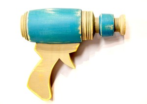 Blue Ray Gun – 2014     1:1 scale prop ray gun made from pine, turned poplar, & paint     approximately 6 x 8 x 3 inches
