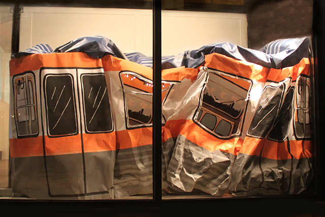 Oops, 2014, installation with screenprints on paper and foamcore, LED lights, cardboard, 5 x 9 x 5 feet