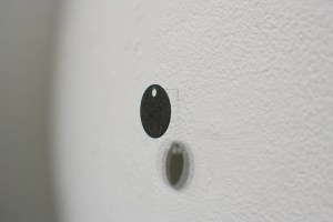 “What happens when you die” 2010 taxidermy fawn, cremation tag taxidermy fawn, bed, cremation tag