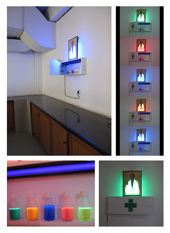 In what colour should I believe in, Saint on wood, wood cabinet, RGB Led, UV black light, phosphorescent liquid, 80 x 60 x 12 cm, 2014 