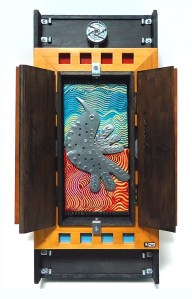 Phoenix:  Wall hanging assemblage sculpture with found objects and painting on canvas  11x17x4.5in 		2013 