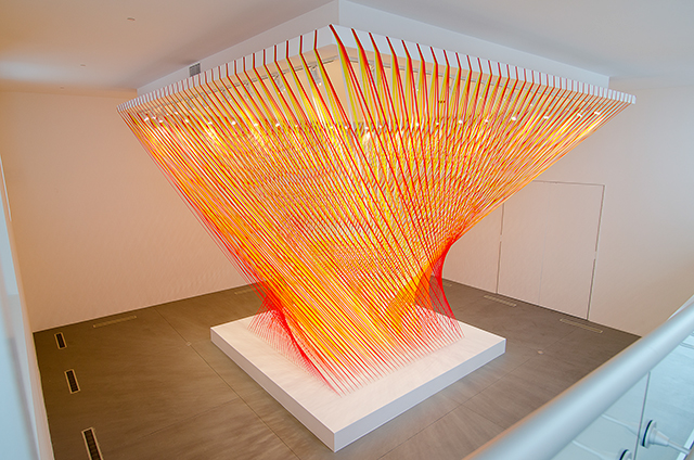 Title: "Rewritten by machine on new technology" Year: 2014 Medium: flagging tape, wood, paint, hardware Size: 30' x 30' x 30'